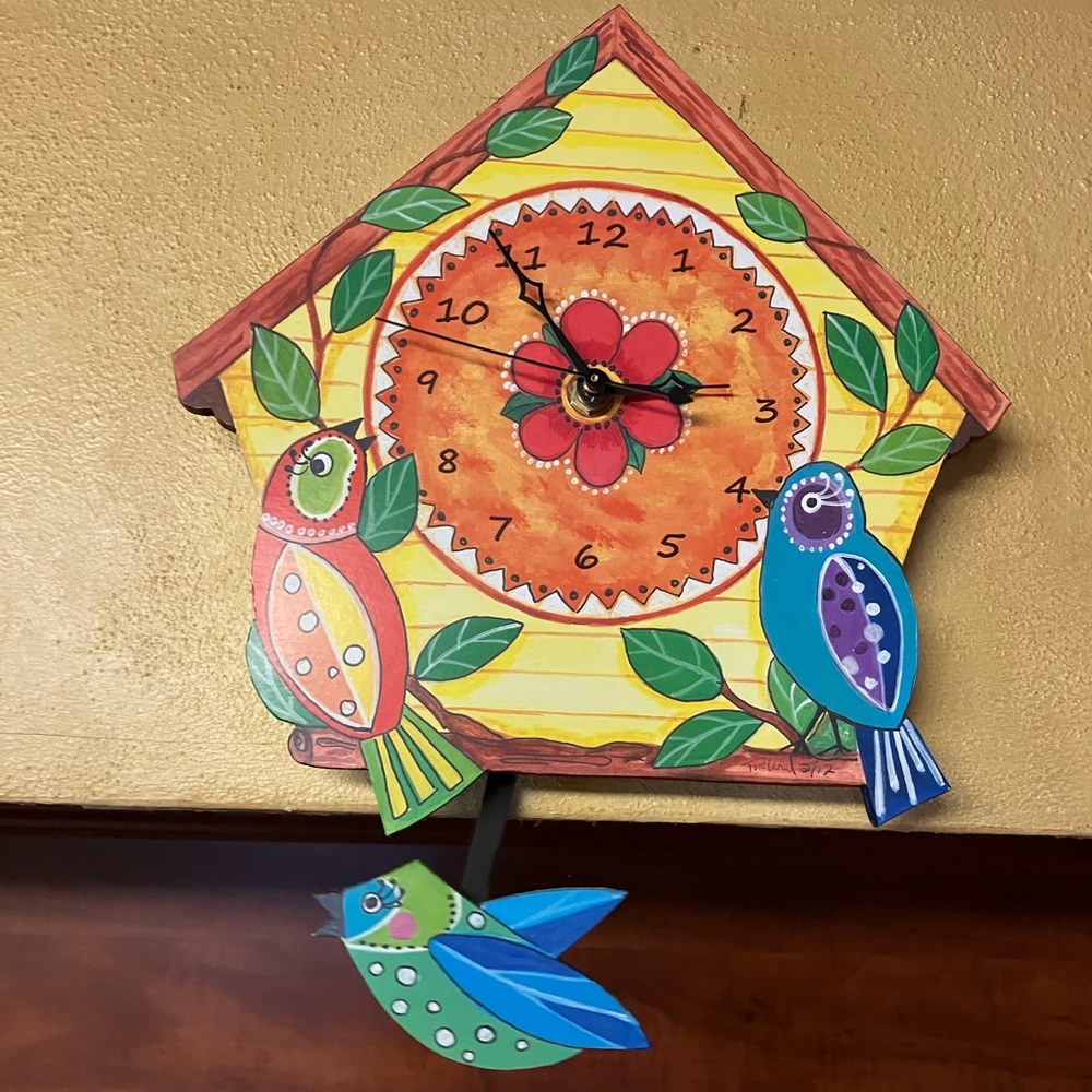 Hand painted wooden clock with moving piece with bird motif